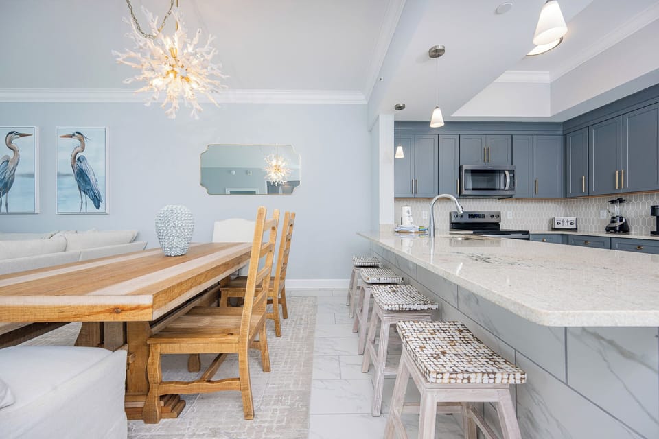 Dine at the rustic table or enjoy casual bites at the bar, surrounded by elegant decor and beachfront views