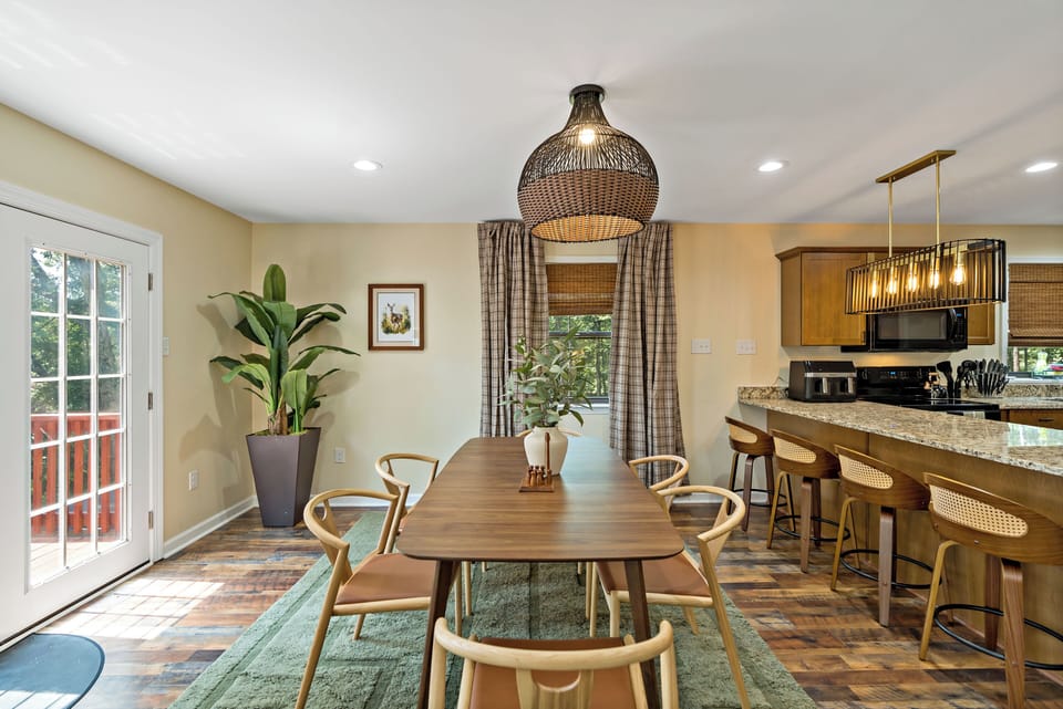 The dining table seats 6 with extra seating at the kitchen counter