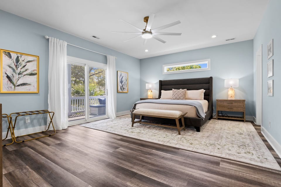 The primary suite is a quiet retreat when you need a break from the action. King bed, Roku Smart TV and private screened porch access.