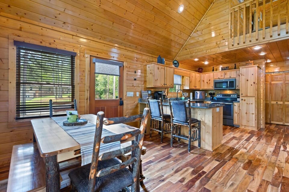Up to 6 can seat comfortably at the dining table, Amish-crafted from hickory.  Benches can stow beneath table.