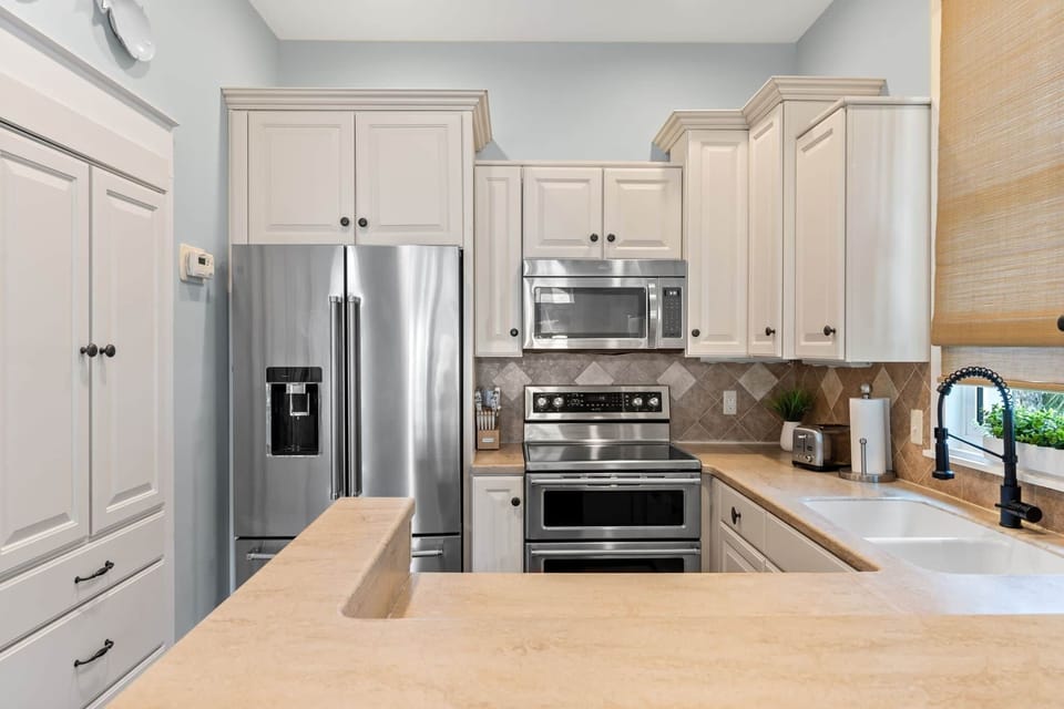 Full kitchen with plenty of dishes and cookware