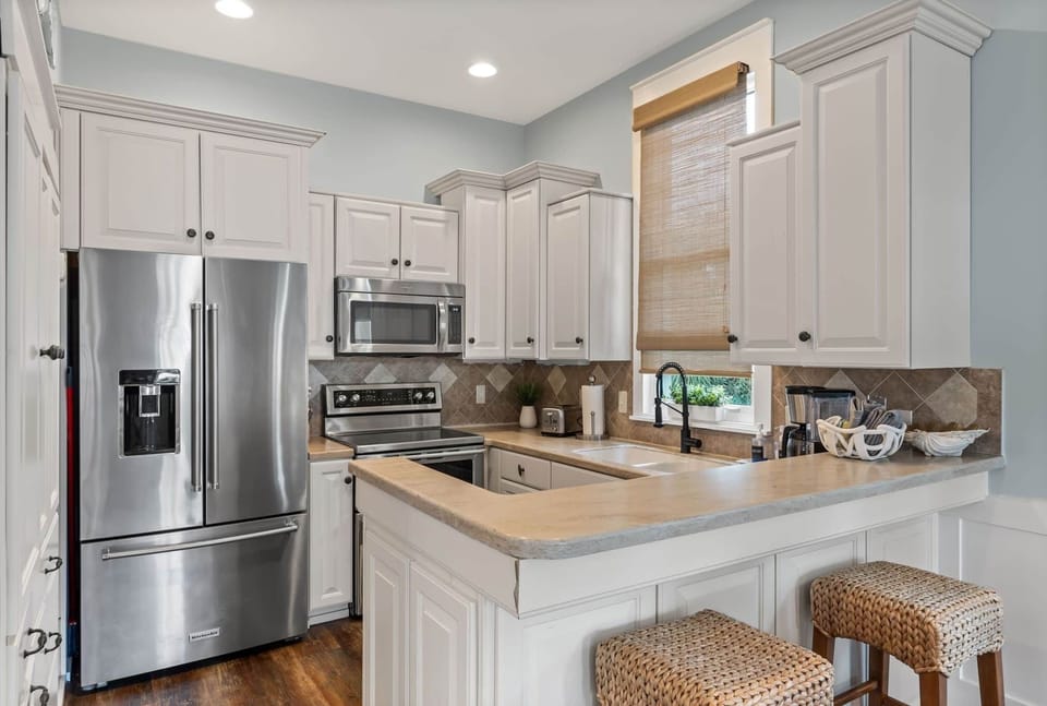 Full kitchen with plenty of dishes and cookware