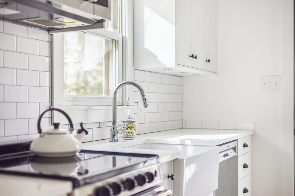 The well-stocked kitchen is bright and ready for all your culinary adventures.