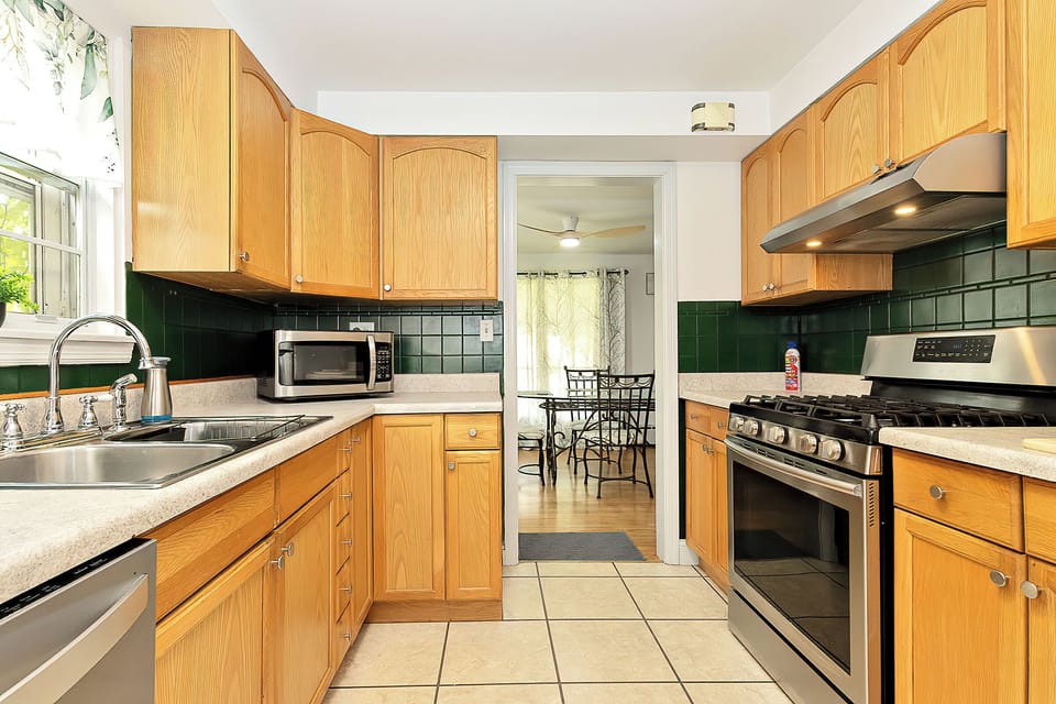 Fully stocked kitchen, equipped with modern appliances, cookware & utensils
