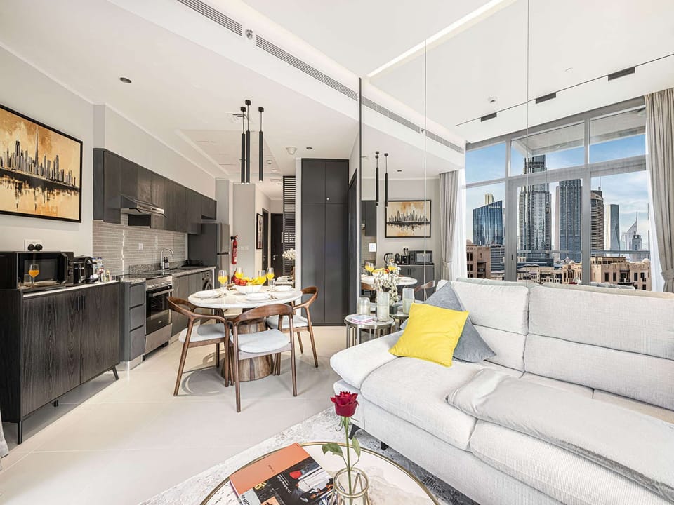 Spacious Living &amp; Dining with Mirror Wall and Accent Lighting
