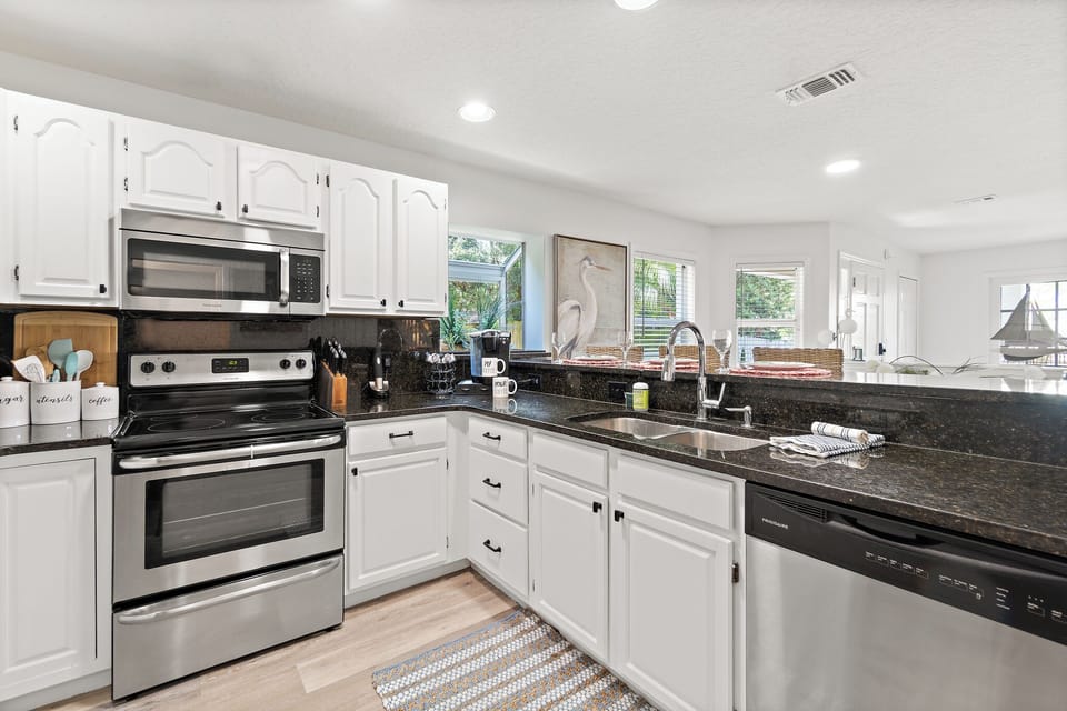 Well appointed kitchen with everything you need to prepare and serve meals