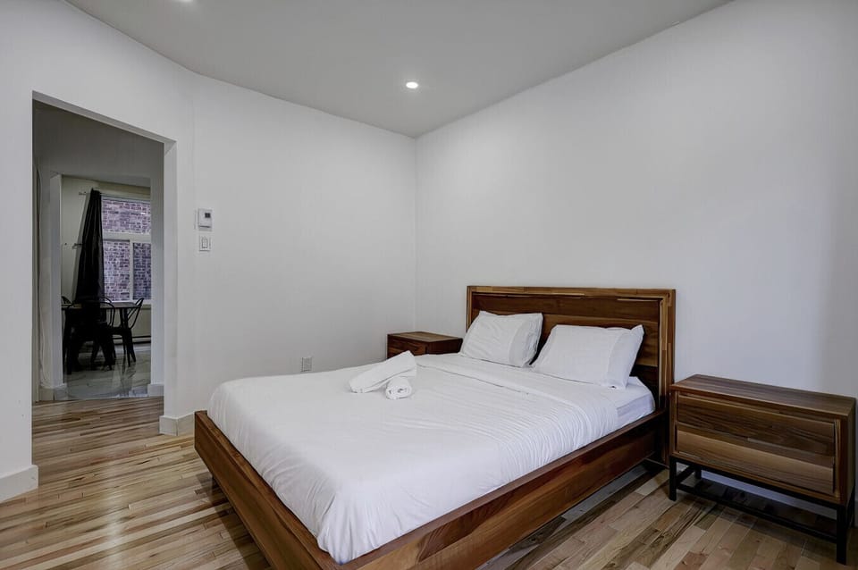 Spacious bedroom with sleek modern touches.