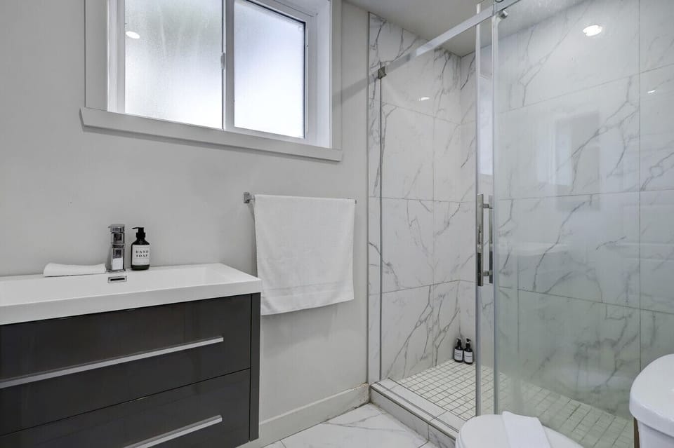 Elegant spa-style bathroom with walk-in shower.