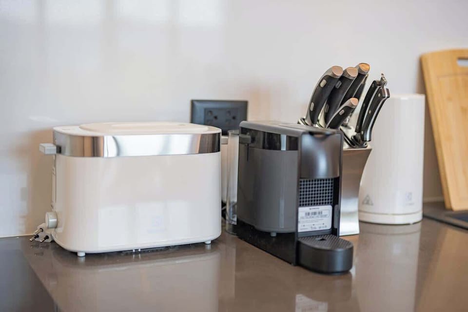 Toaster, coffee machine, kettle. 