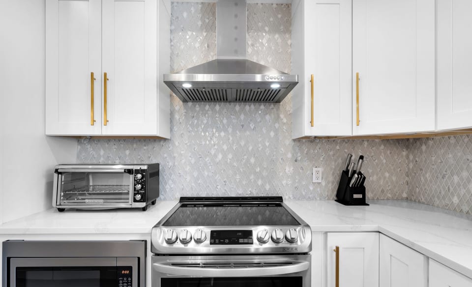 The kitchen has all the basic tools and utensils you need, conveniently located right next to the dining area for easy meals! | White Sands, Paradise Isles, Destin | Voyax Luxury Vacation Rentals