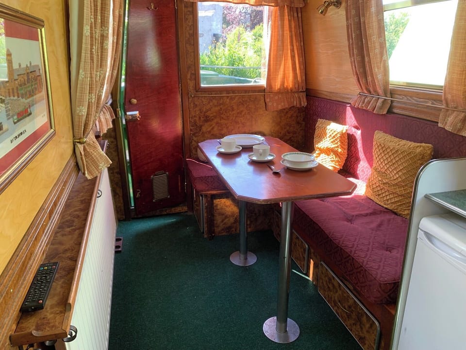 Living Room/Dinette easily converts to a double bed. Ample storage in draws under the settee.