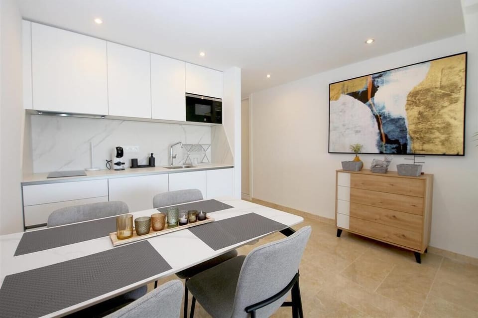More pictures of the dining area for four guests next to the kitchen