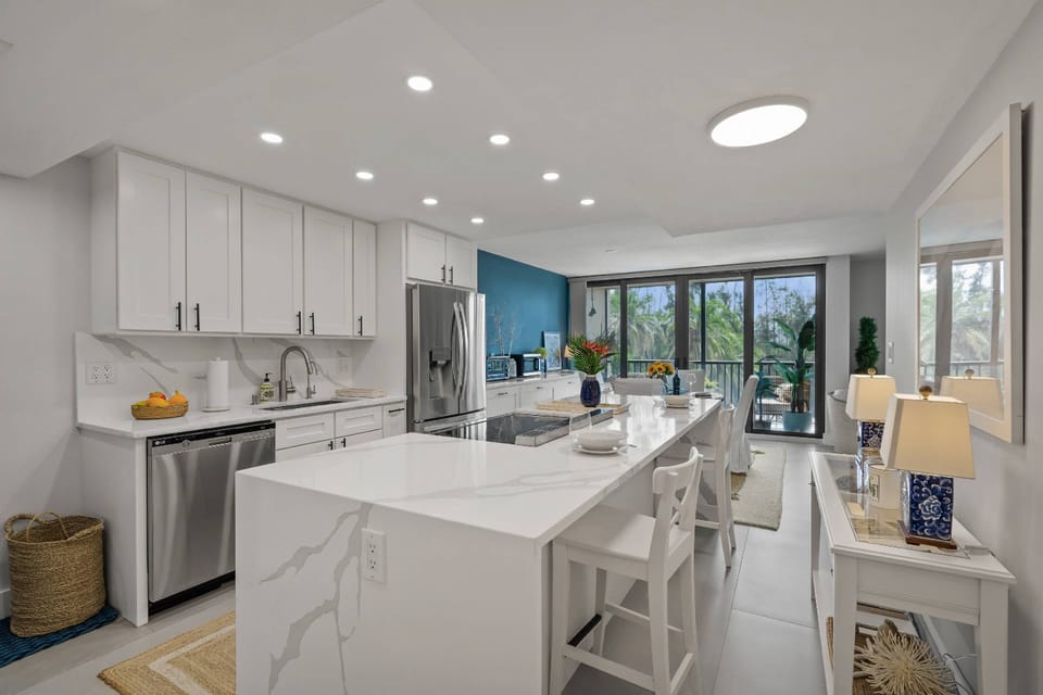 The heart of the condo – sleek surfaces, open layout, and everything you need to dine in.