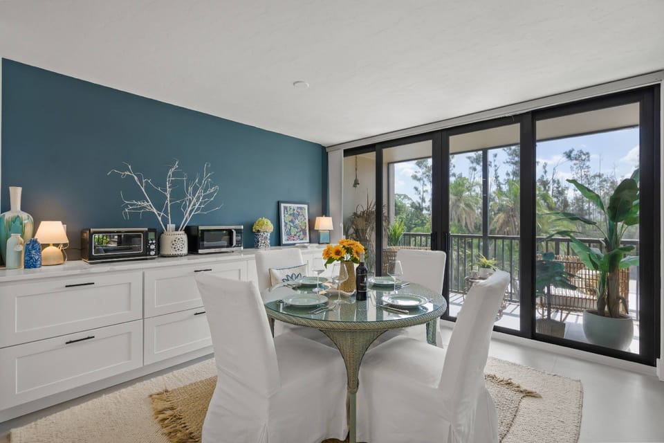 Dine indoors with sunshine and views streaming through floor-to-ceiling sliders