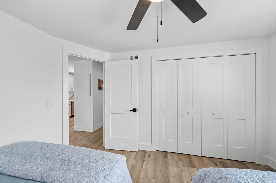 Guest bedroom with full size closet and built in drawers