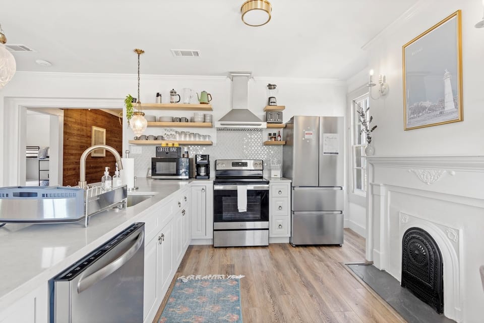 Whip up delicious meals in this stylish kitchen with quartz counters and modern appliances!