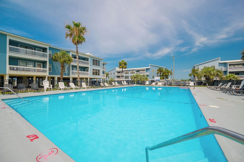 Make a splash on your next beach retreat in this inviting outdoor pool at Sea Oats in Gulf Shores