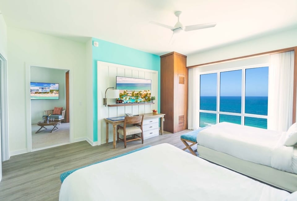 Unit with 1 King bed and 2 Queen beds. Exact unit will be assigned upon arrival. Views, colors, and decor may vary.