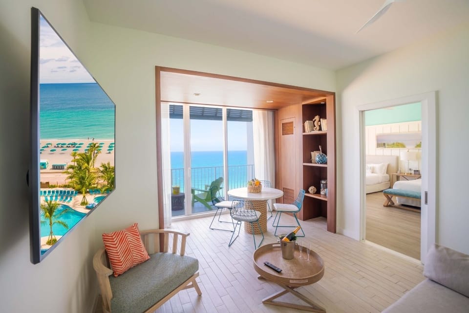 Living area. Unit with 2 Queen beds. Exact unit will be assigned upon arrival. Views, colors, and decor may vary.