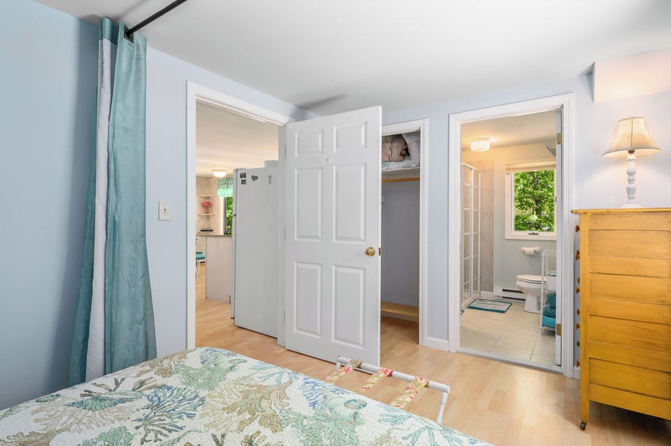 View from the bed into the bathroom and living room