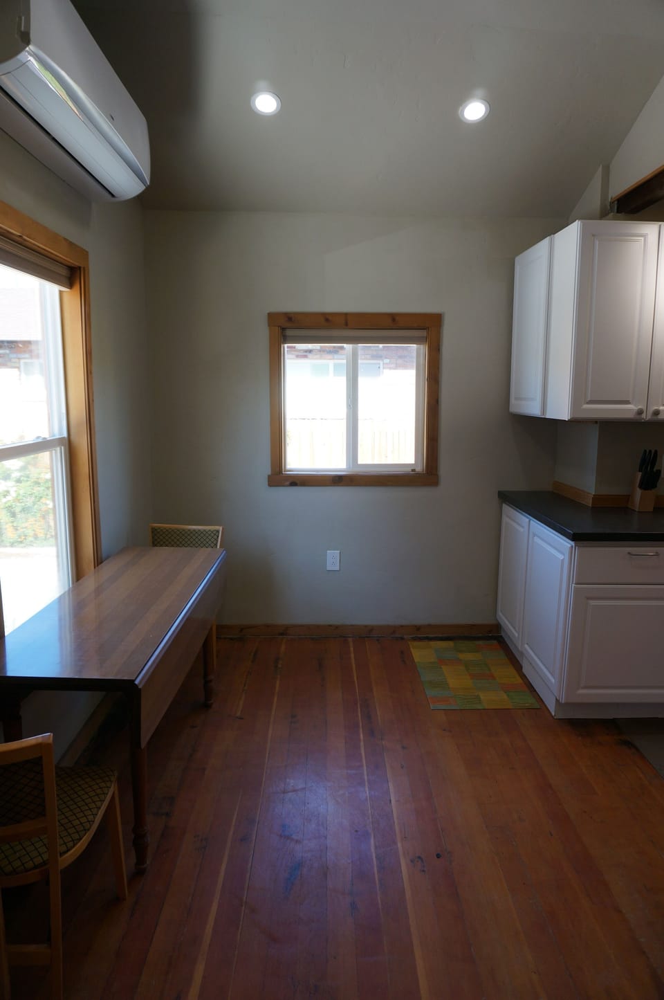 Dining room table has drop down leaves and 4 chairs