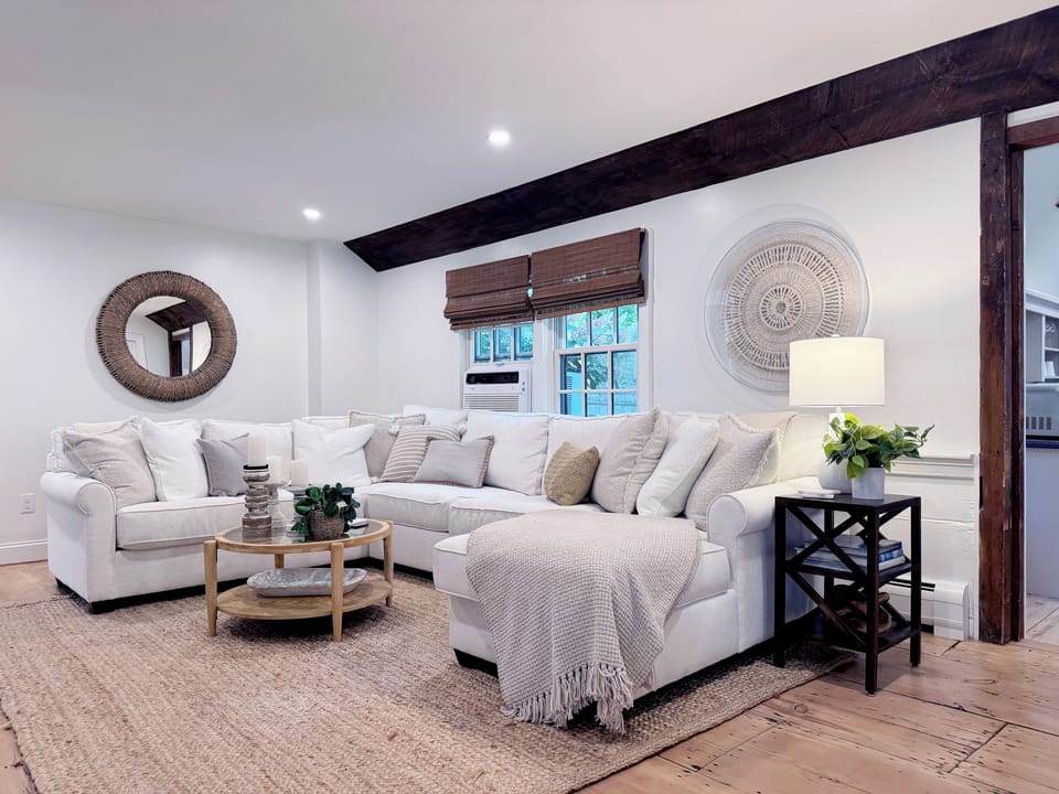 Living room area with access to dining area and sitting area.