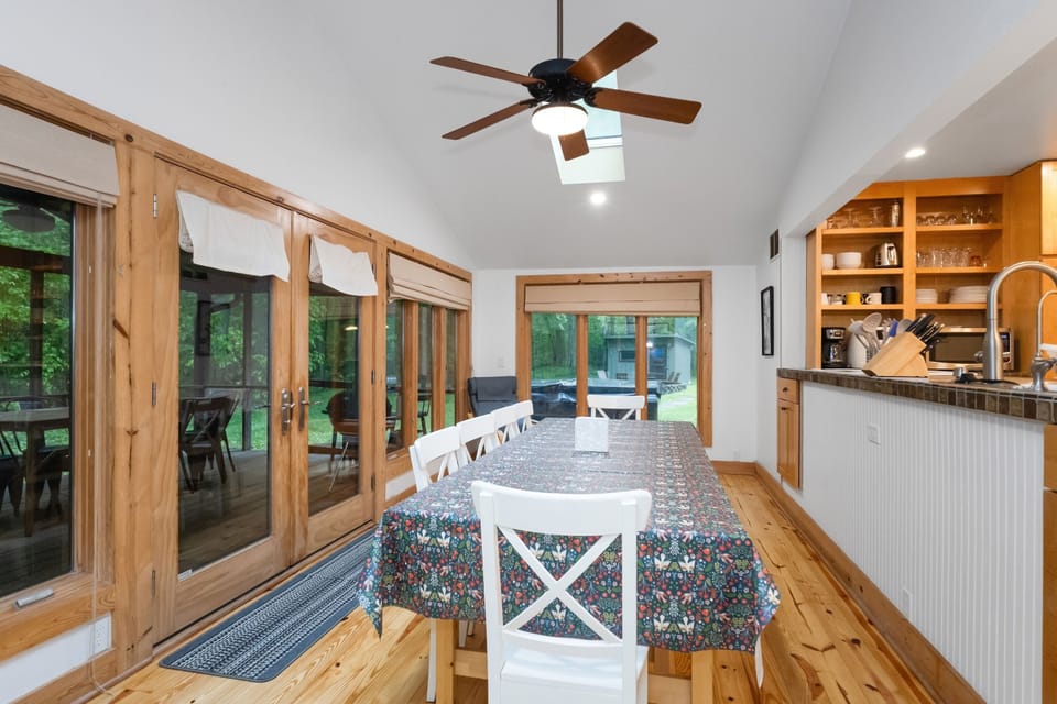 Dining table comfortably seats eight and sits close to the kitchen for easy meal service and effortless entertaining.
