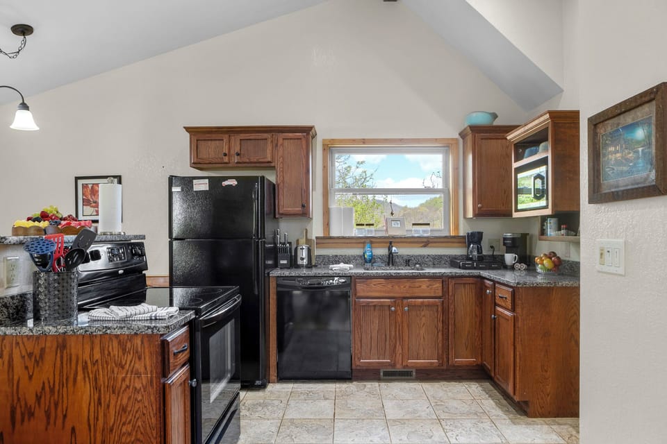 Kitchen: Bright and inviting space with modern appliances and scenic mountain views!
