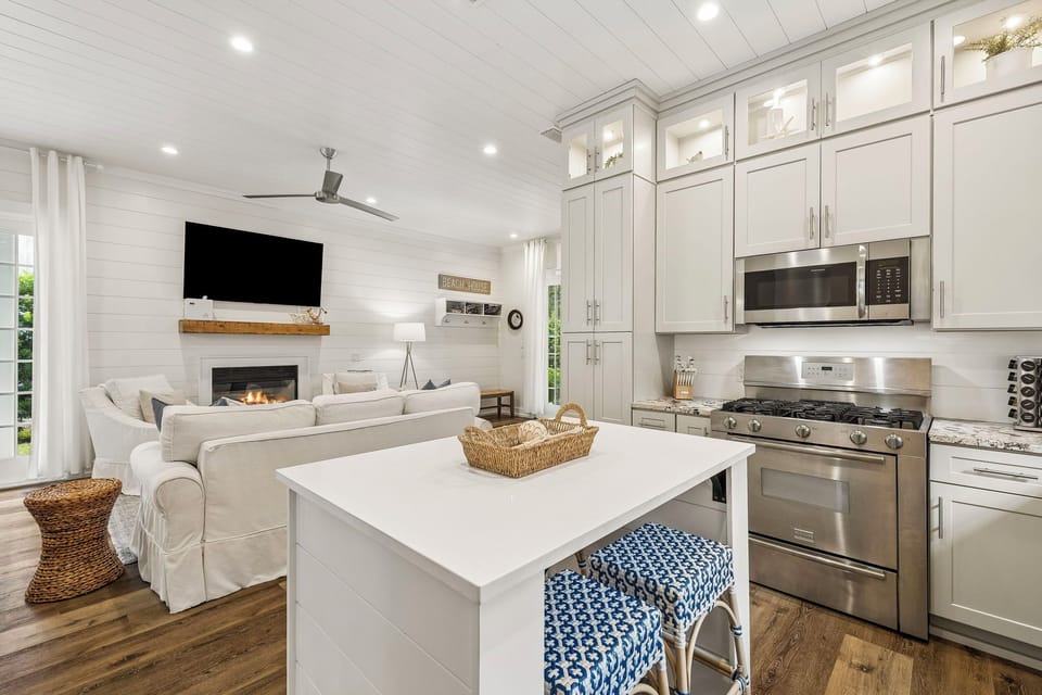 The island offers stylish bench seating—perfect for quick bites or keeping the cook company!