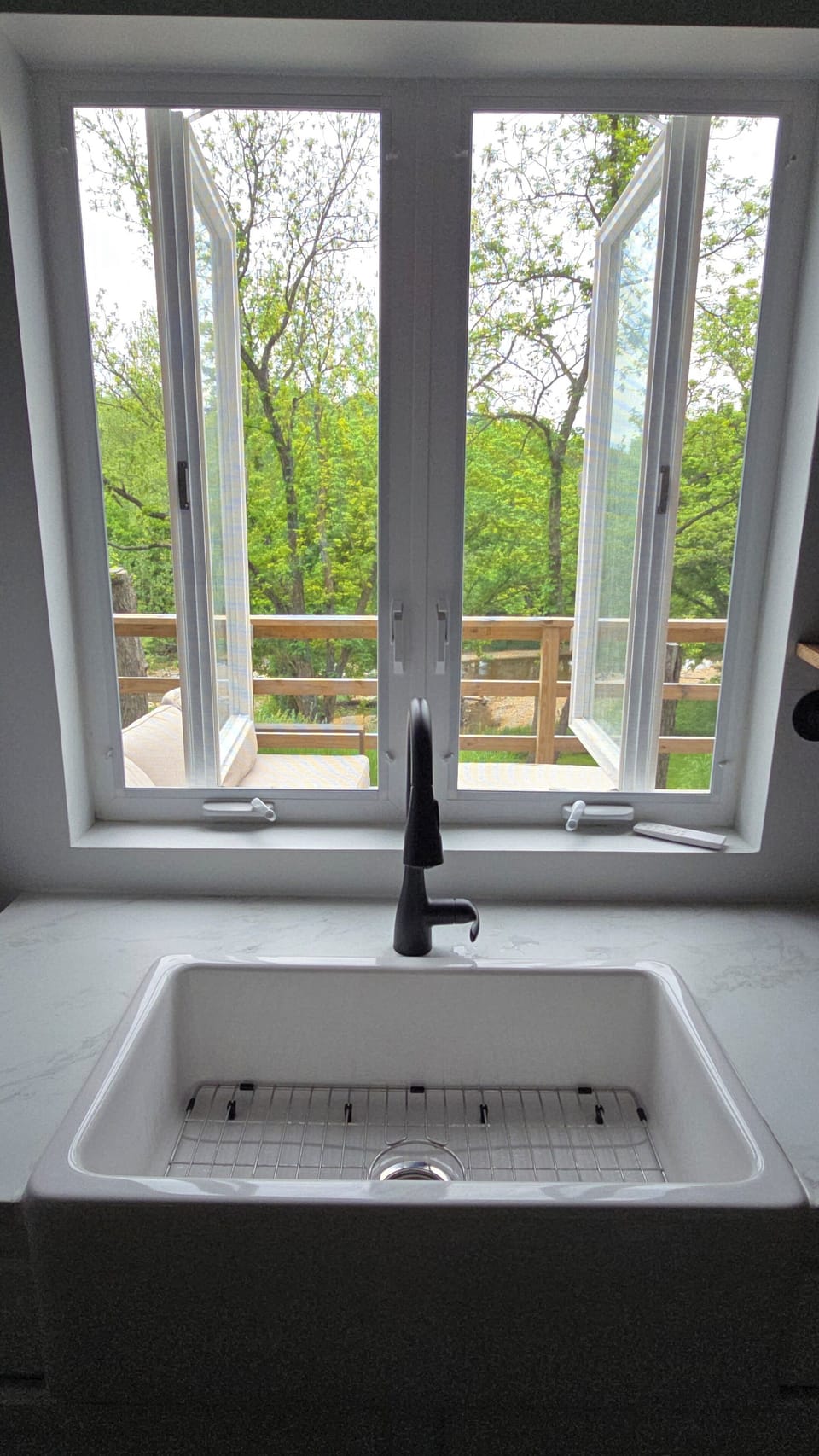 Open the kitchen window doors and bring the  views & sound of nature indoors. 