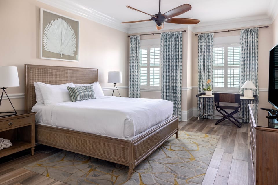 Unwind in a sunlit king bedroom with breezy coastal style.