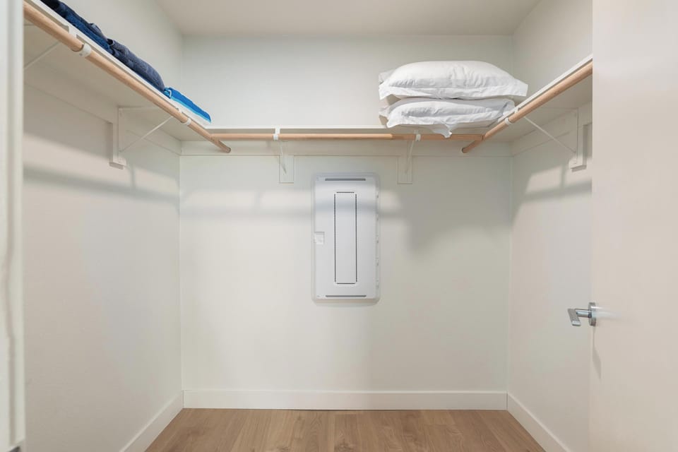 Generous walk-in closet with extra linens and storage space