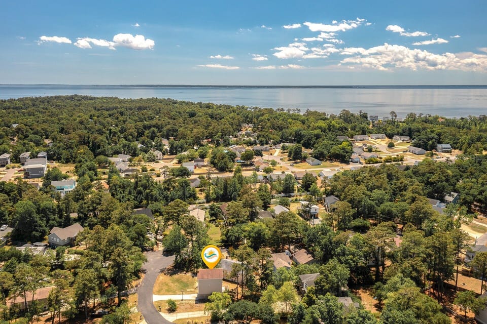 Tucked away at the end of a cul-de-sac, this cozy coastal home offers peace of mind for families with kids and easy access to an array of community amenities.