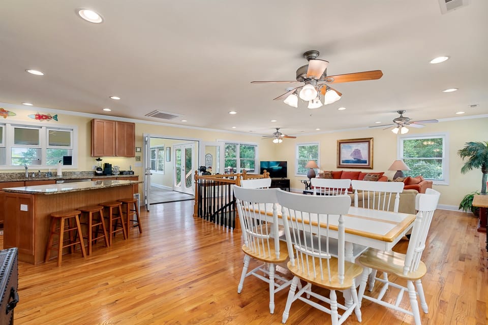 Open floor plan from the main door with kitchen, breakfast, and sitting room.