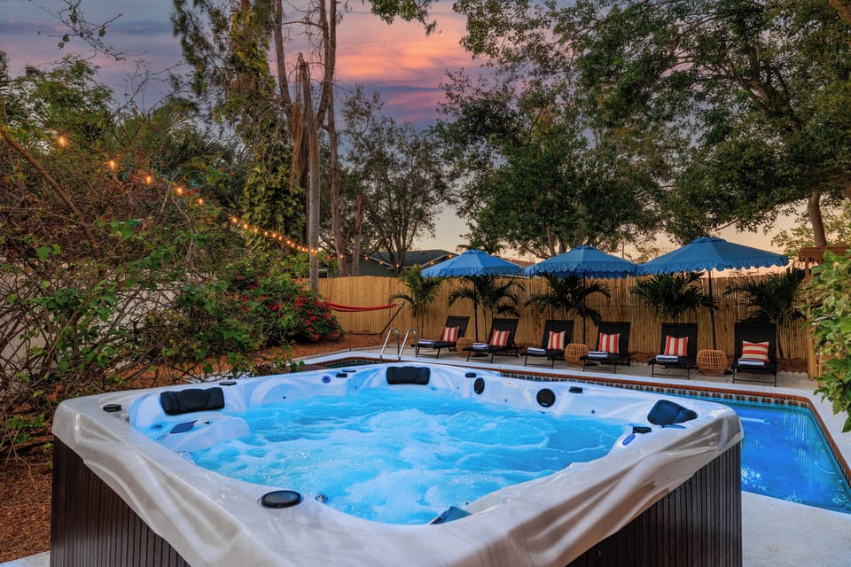 Large hot-tub with mood lighting ~ relaxing cabanas~ hammock~ bistro lighting