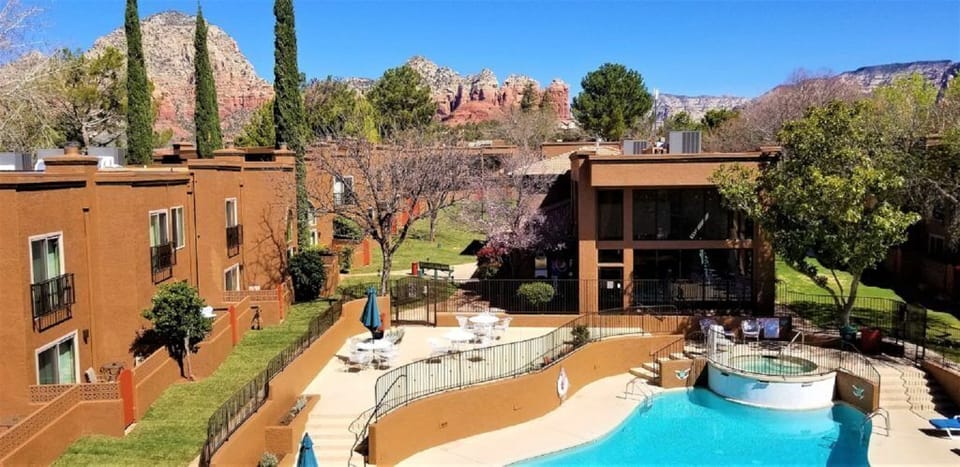 Take in breathtaking red rock formations while lounging by the pool, with comfortable seating options and a picturesque backdrop.