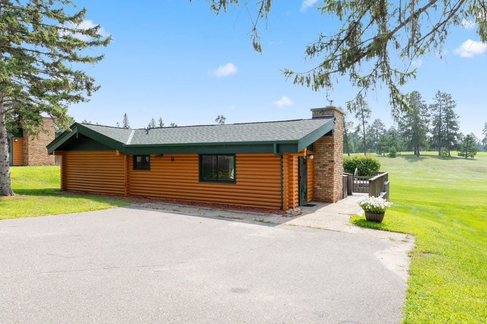 The exterior showcases the classic chalet design with vibrant colors, inviting you to enjoy family-friendly fun in the great outdoors.