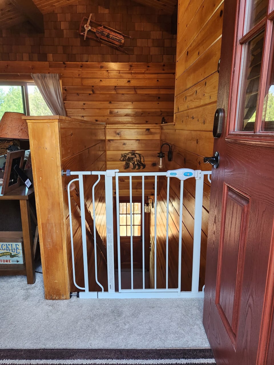 Baby gate available. Located behind living room couch, easy assemble.