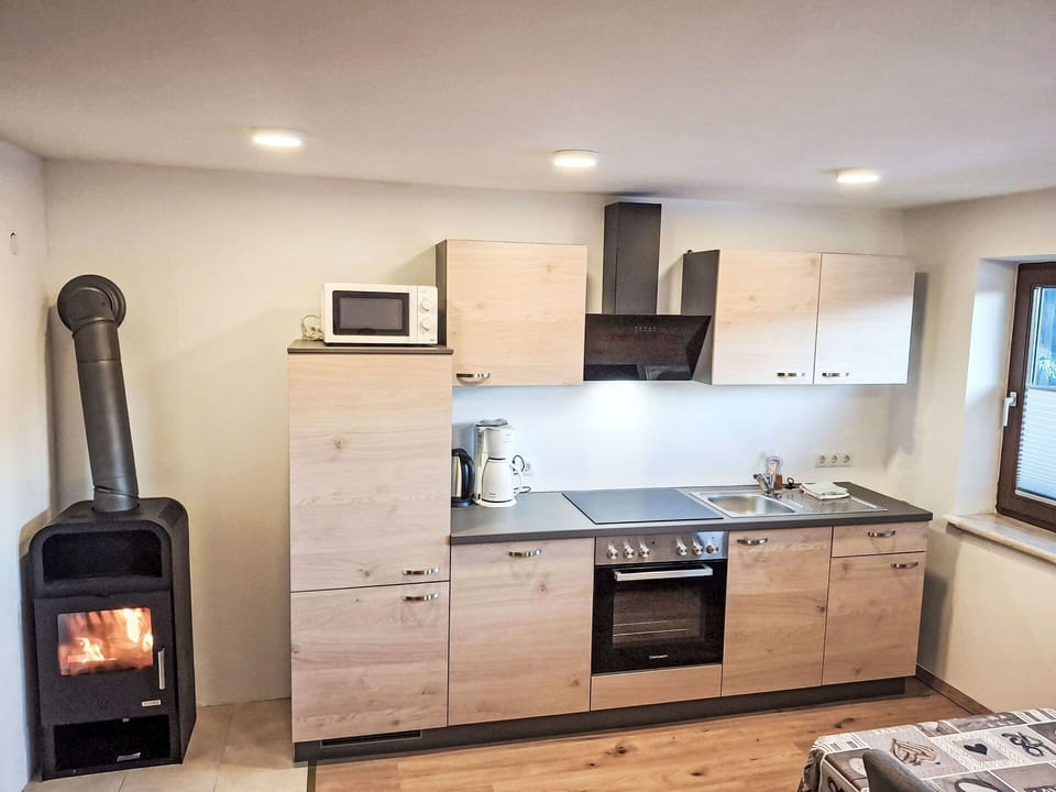 Wood, Furniture, Kitchen Appliance, Cabinetry, Kitchen, Countertop, Interior Design, Home Appliance, Flooring, Major Appliance