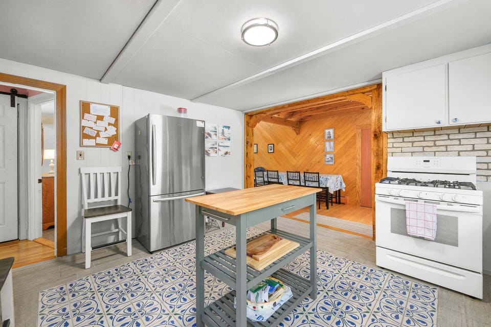 Fully equipped kitchen looking into the dining area