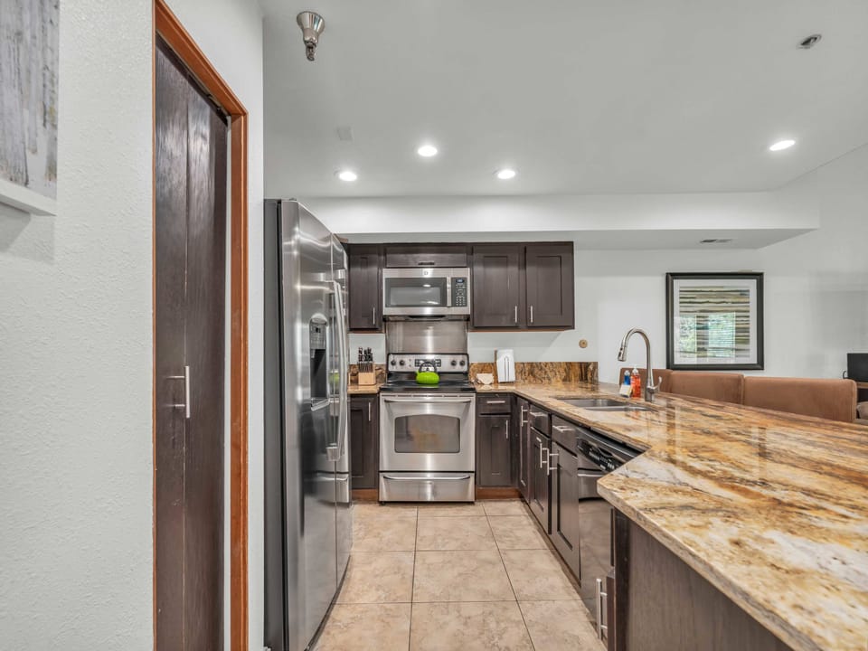 Kitchen: Main floor, drip coffee maker, Keurig, toaster, cooking utensils, tableware

