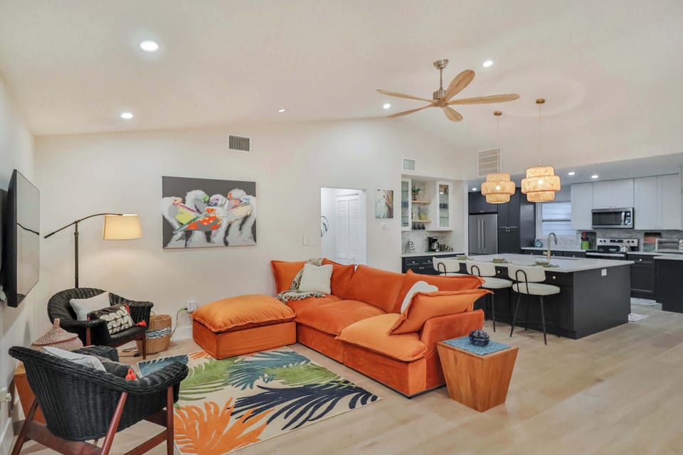 Open floorplan living and kitchen area with high ceilings.  
