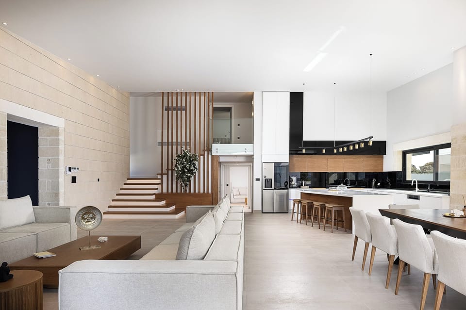 The fully equipped kitchen features premium BOSCH appliances, a wine cooler, and all the essentials for a seamless self-catered stay.