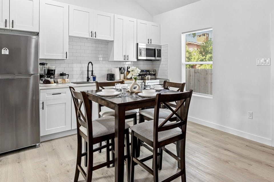 Charming dining table that sits 4 with full tableware and silverware included.