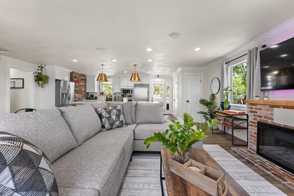 From coffee on the couch to dinner under golden pendant lights—this airy living space blends cozy vibes with modern flair for the perfect home-away-from-home.