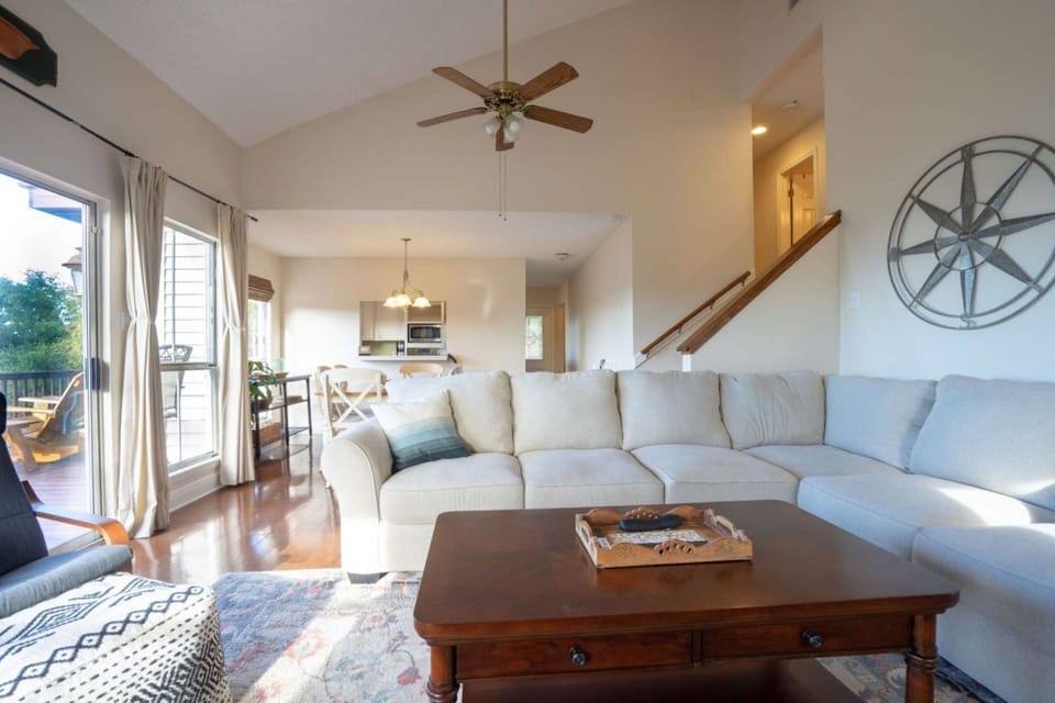 Living area leads into dining table and kitchen