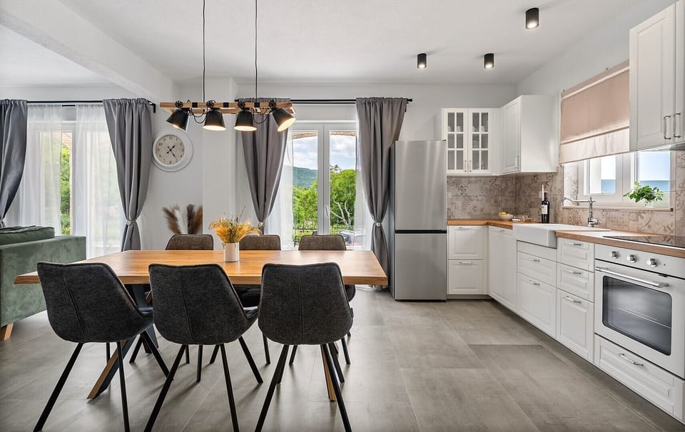 A fully equipped kitchen with all modern appliances (dishwasher, oven, microwave, kettle,  toaster)