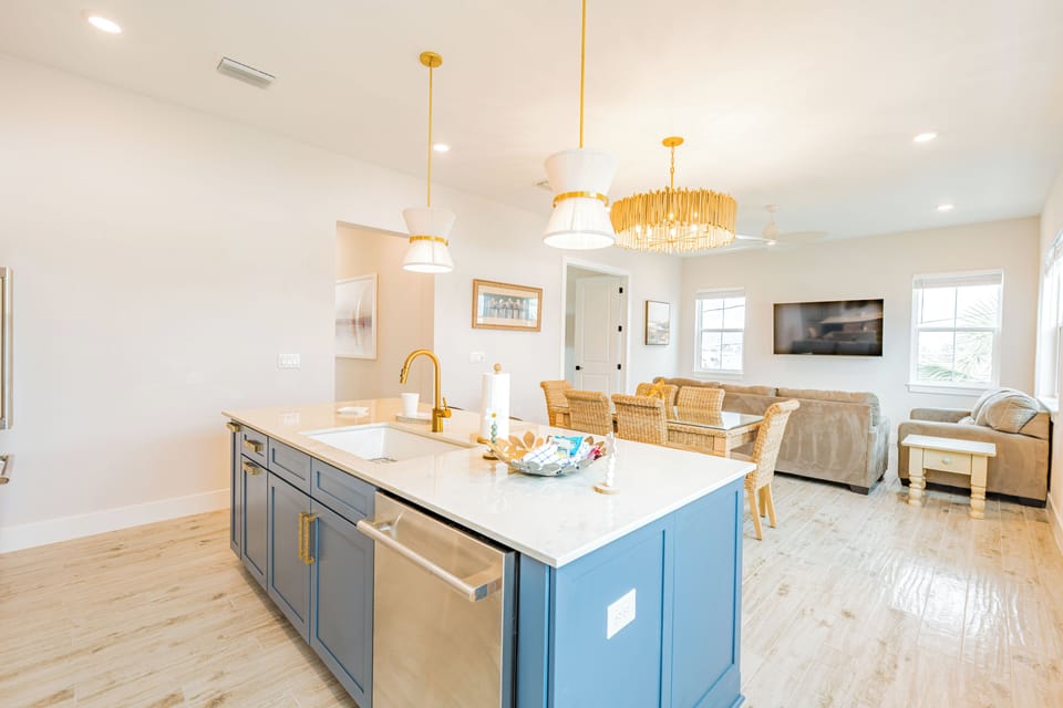 Bright and stylish kitchen with gold hardware and a breezy coastal-boho design that feels both modern and relaxed.