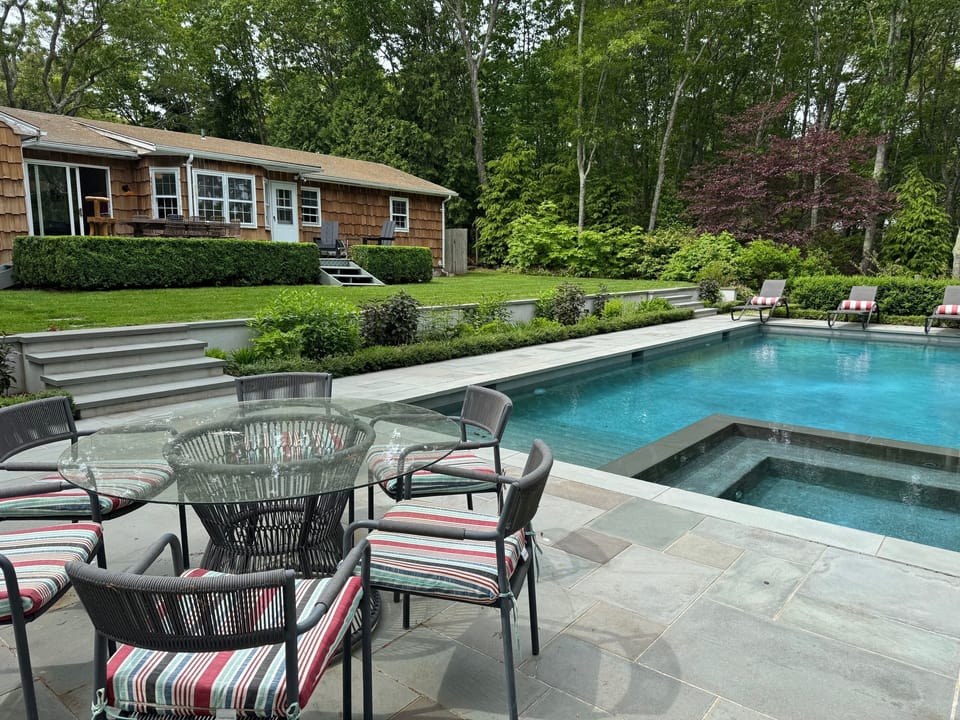 heated pool  with dining spot for 8