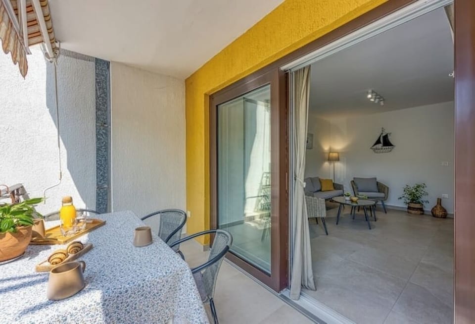 large sliding door between the Living Room and the Terrace.